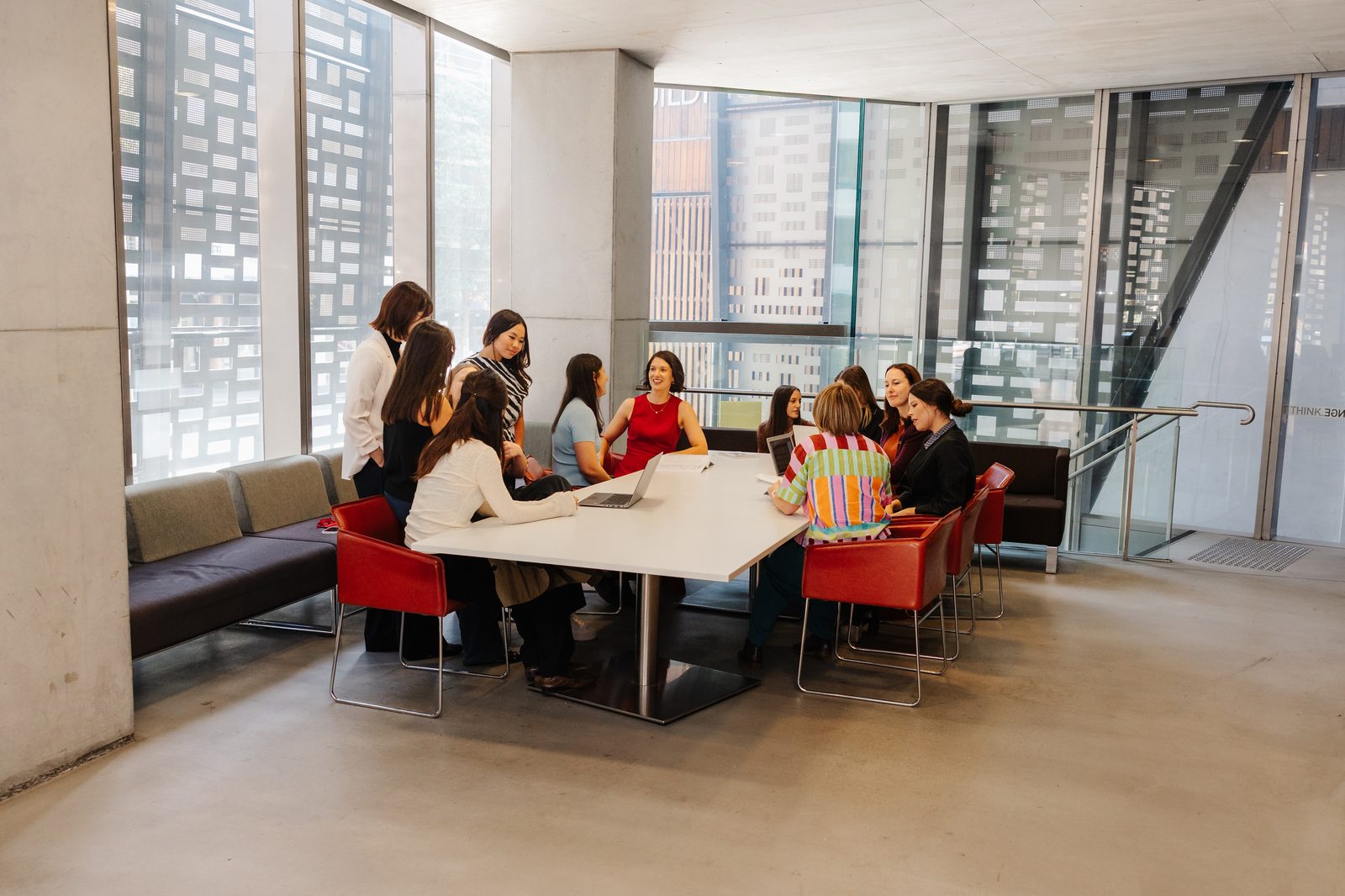 A warm, collaborative team meeting in a bright room